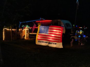 Camper's with patriotic decorations on their RV