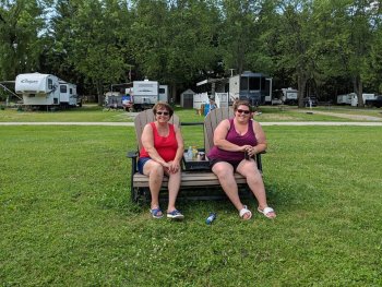 Two female camper's relaxing at The Ridge Campground