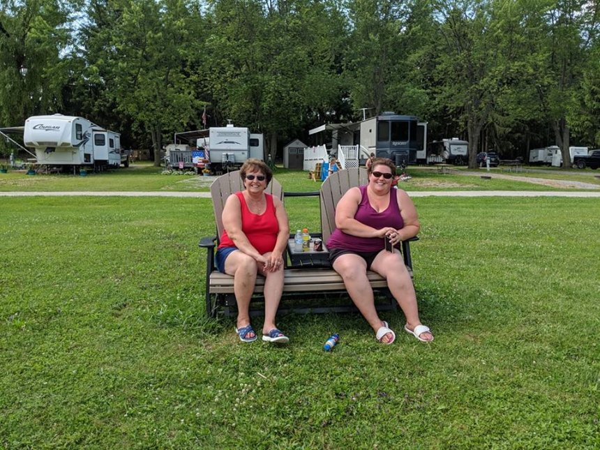 Campers Sitting in the Field