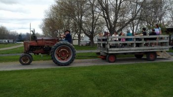 Camper's enjoying a wagon ride at The Ridge Campground