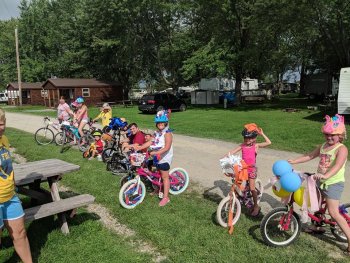 Young camper's posing on their bicycles