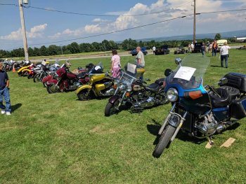 Several motorcycles lined up at The Ridge Campground