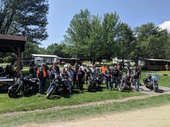 Several biker's pose at The Ridge Campground